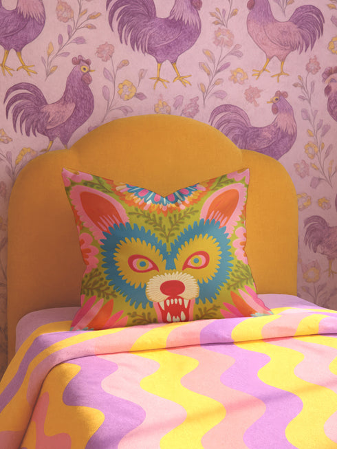 A square throw pillow cover featuring a vibrant, symmetrical illustration of an angry opossum face. The design mimics the texture of folk art embroidery but is a smooth flat print on faux linen fabric. The possum features teal blue fur, bright yellow eyes with pink pupils, and a red nose, bearing sharp white teeth in a hiss or scream. The background is a mossy green with pink and orange floral accents surrounding the animal. The style is maximalist, eclectic, colorful, and feral core aesthetic.