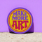 A round embroidered patch with the words "MAKE MORE ART" in a retro 70s psychedelic font. The word "ART" is magenta pink, "MAKE MORE" is purple, and they are set against a bright yellow circular background. The entire design is encircled by a thin pink line and a thick purple border. This 3-inch iron-on applique is a colorful, groovy accessory for DIY projects, perfect for personalizing jackets, backpacks, or denim vests. It serves as an inspirational artist gift with a vintage aesthetic.
