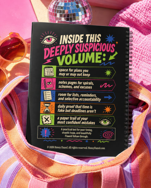 A black hardcover undated planner with black wire spiral binding. The front cover displays a bold, colorful typographic layout reading: "THINGS I AGREED TO WHILE TIRED". Surrounding text includes "LATE-NIGHT DECISIONS VOLUME 1", "ZERO MEMORY OF THIS.", and "A PRACTICAL GUIDE TO POOR TIMING." The back cover reads "INSIDE THIS DEEPLY SUSPICIOUS VOLUME:" above five colored banner rows detailing space for plans, notes for spirals, room for lists, daily proof time is fake, and a paper trail of mistakes.