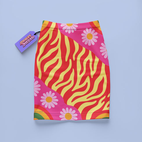 Form-fitting mini skirt featuring a vibrant, retro-inspired maximalist pattern. The design showcases a diagonal hot pink band filled with white and yellow daisies, contrasting against a bold background of wavy, abstract red and yellow flame-like stripes. The bottom edge includes curved color blocks of green and orange. Made of a smooth, stretchy fabric with a mid-rise elastic waistband, hitting at mid-thigh. Available in both a matte black-light reactive finish and a metallic glitter finish.
