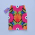 Form-fitting bodycon mini skirt with a mid-rise elastic waistband, falling to mid-thigh in smooth stretch fabric. It features a bold 70s pop art floral print: oversized hot pink flowers with cream scalloped centers, royal blue middles, and fine purple rays, beside a flaming orange tulip, royal blue geometric shapes, and olive green leaves on a black background. The all-over design is a flat dye-sublimated print in vibrant, high-contrast color, available in a smooth knit or glitter knit finish.