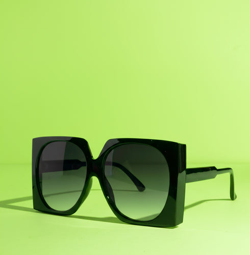 Oversized mod square sunglasses with chunky frames and gradient polycarbonate lenses, providing UV400 protection. Fashion shades in three colorways—gloss black, classic tortoise, and translucent orange—styled in a retro 70s, Jackie-O inspired silhouette. Lightweight, comfortable fit for everyday wear, festivals, and street style. Statement sunglasses by Honey Dazed for alt, maximalist fashion lovers.