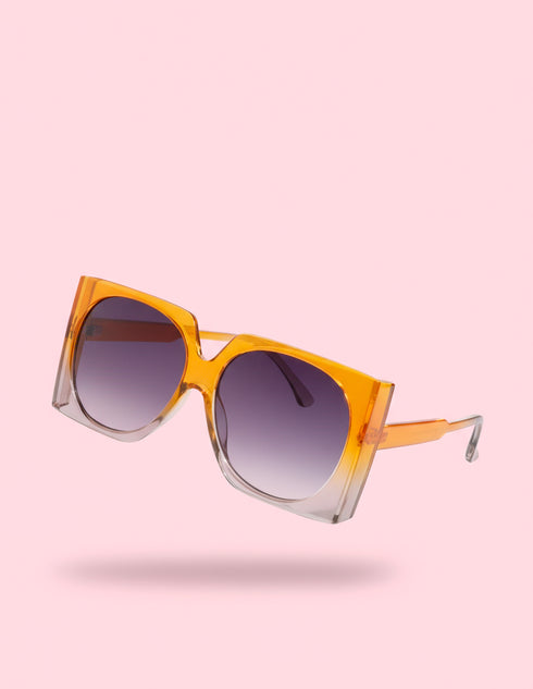 Oversized mod square sunglasses with chunky frames and gradient polycarbonate lenses, providing UV400 protection. Fashion shades in three colorways—gloss black, classic tortoise, and translucent orange—styled in a retro 70s, Jackie-O inspired silhouette. Lightweight, comfortable fit for everyday wear, festivals, and street style. Statement sunglasses by Honey Dazed for alt, maximalist fashion lovers.