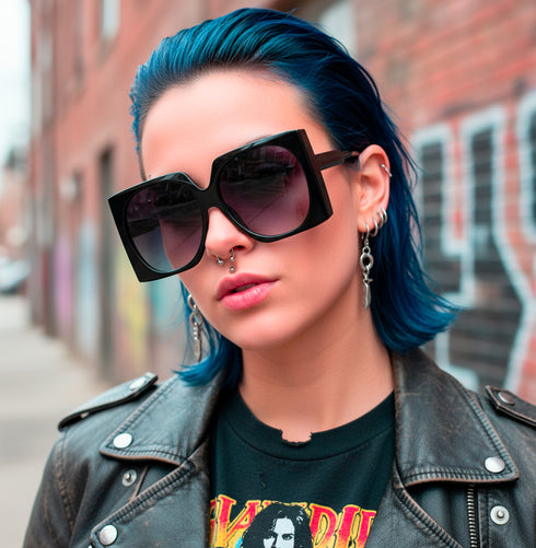 Oversized mod square sunglasses with chunky frames and gradient polycarbonate lenses, providing UV400 protection. Fashion shades in three colorways—gloss black, classic tortoise, and translucent orange—styled in a retro 70s, Jackie-O inspired silhouette. Lightweight, comfortable fit for everyday wear, festivals, and street style. Statement sunglasses by Honey Dazed for alt, maximalist fashion lovers.