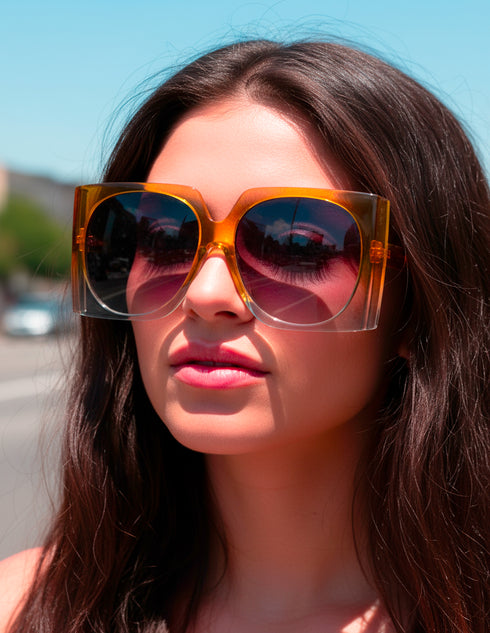 Oversized mod square sunglasses with chunky frames and gradient polycarbonate lenses, providing UV400 protection. Fashion shades in three colorways—gloss black, classic tortoise, and translucent orange—styled in a retro 70s, Jackie-O inspired silhouette. Lightweight, comfortable fit for everyday wear, festivals, and street style. Statement sunglasses by Honey Dazed for alt, maximalist fashion lovers.