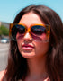 Oversized mod square sunglasses with chunky frames and gradient polycarbonate lenses, providing UV400 protection. Fashion shades in three colorways—gloss black, classic tortoise, and translucent orange—styled in a retro 70s, Jackie-O inspired silhouette. Lightweight, comfortable fit for everyday wear, festivals, and street style. Statement sunglasses by Honey Dazed for alt, maximalist fashion lovers.