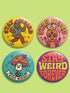 Set of 4 bright retro pinback buttons 2.25 inch. 1: Yellow button with cartoon Bigfoot in blue Hawaiian shirt and sunglasses striding under "Stay Weird" text. 2: Pink button with orange three-eyed alien in party hat holding a balloon. 3: Teal button with smiling mushroom in top hat riding a unicycle with "Stay Weird" banner. 4: Purple button with orange and yellow psychedelic 70s font reading "Stay Weird Forever." High gloss finish metal pins for backpacks, jackets, and weirdcore gifts.