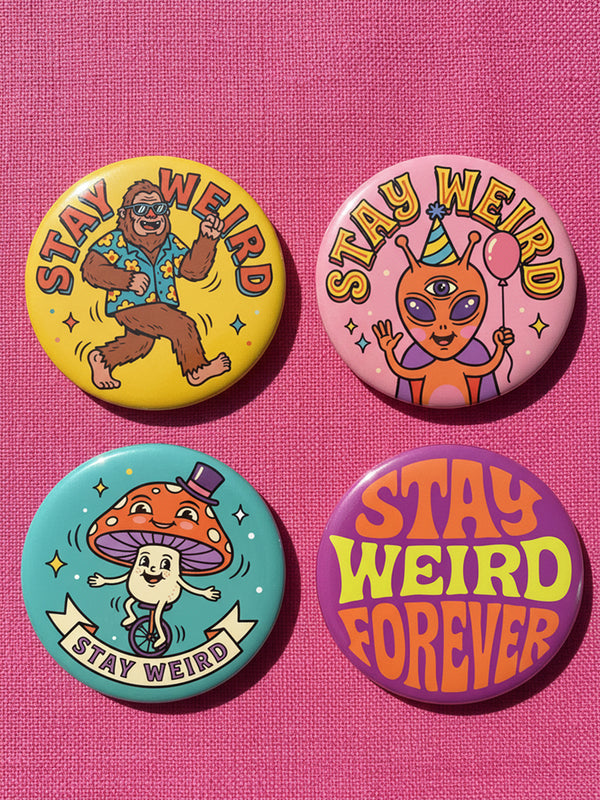 Set of 4 bright retro pinback buttons 2.25 inch. 1: Yellow button with cartoon Bigfoot in blue Hawaiian shirt and sunglasses striding under "Stay Weird" text. 2: Pink button with orange three-eyed alien in party hat holding a balloon. 3: Teal button with smiling mushroom in top hat riding a unicycle with "Stay Weird" banner. 4: Purple button with orange and yellow psychedelic 70s font reading "Stay Weird Forever." High gloss finish metal pins for backpacks, jackets, and weirdcore gifts.