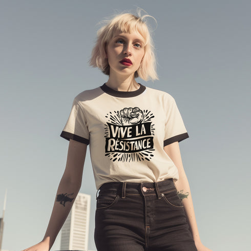 White and black ringer tee with a bold “Vive La Résistance” graphic, featuring a raised fist illustration and a vintage protest style.