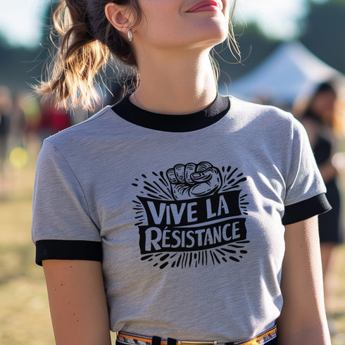 White and black ringer tee with a bold “Vive La Résistance” graphic, featuring a raised fist illustration and a vintage protest style.