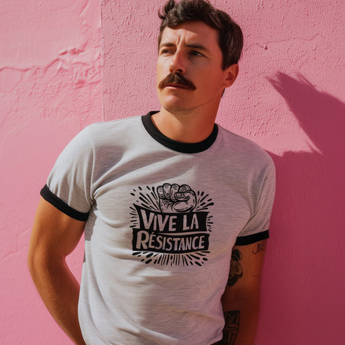 White and black ringer tee with a bold “Vive La Résistance” graphic, featuring a raised fist illustration and a vintage protest style.