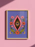 A vertical art print featuring a central pink yoni shape with a black interior containing a single eye. Golden yellow sun rays radiate from the center against a solid periwinkle blue purple background. The central motif is surrounded by a symmetrical botanical border of pink and red daisy flowers and green leaves, with two yellow crescent moons in the bottom corners. Printed on flat museum grade matte paper. This is the printed artwork only; a frame is not included. Ready to frame.