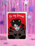 A vertical greeting card featuring a flat vector illustration of Robert Smith from The Cure against a vibrant red background. He has messy black hair, pale skin with smeared lipstick, and wears black cat ears. He is surrounded by four black cats with pink collars. White script text at the top reads "Be my Lovecat." The card is printed on shimmery pearlescent cardstock that catches the light. A high-quality alternative Valentine or anniversary card for goth music lovers and post-punk fans.