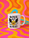 White ceramic 11oz coffee mug featuring a bold tattoo-style graphic with an angry yellow lemon face, black bat wings, and barbed wire details. The design reads “SOUR NOT SORRY” in gothic black lettering above and below the lemon. C-handle, durable construction, dishwasher and microwave safe. Graphic is high-contrast and punk-inspired, perfect for adding attitude to your drinkware collection.