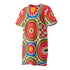 Short sleeve crew neck t-shirt dress on a cream background with an allover retro mod flower medallion print. Bold 60s daisies in red, yellow, and white sit at the center of concentric rainbow rings in lime green, hot pink, orange, and royal blue, with small magenta squares and tiny red checkerboard accents between the motifs. Above-the-knee straight fit silhouette in a 95 percent cotton, 5 percent elastane heavyweight stretch blend. Groovy retro flower power dress for dopamine dressing and easy summer outfi