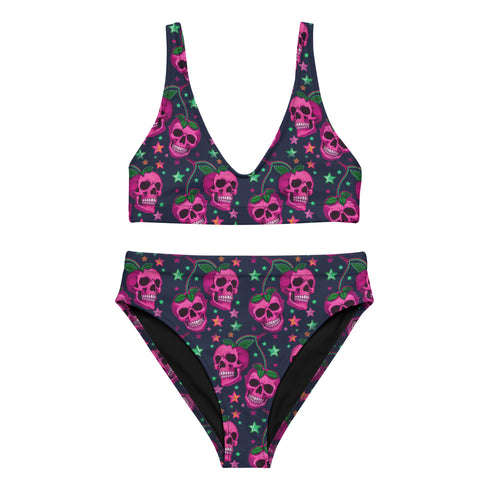 Two-piece bikini set featuring a bold pastel goth design with neon pink skulls wearing green bows, surrounded by multicolored stars on a deep black background. The set includes a plunging V-neck bikini top with wide straps and high-waisted bottoms for a flattering retro fit. Made of stretchy, soft material with a smooth black lining. This skull print swimsuit is ideal for alternative, edgy summer style with a playful punk twist.