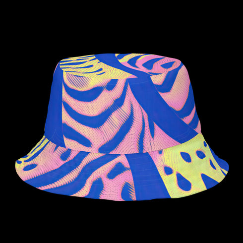 Reversible bucket hat with a bold all-over psychedelic tiger stripe print in pink, blue, yellow, and black; made of moisture-wicking polyester with a linen-texture feel; available in sizes XS, S/M, and L/XL; features two different sides with unique patterns.
