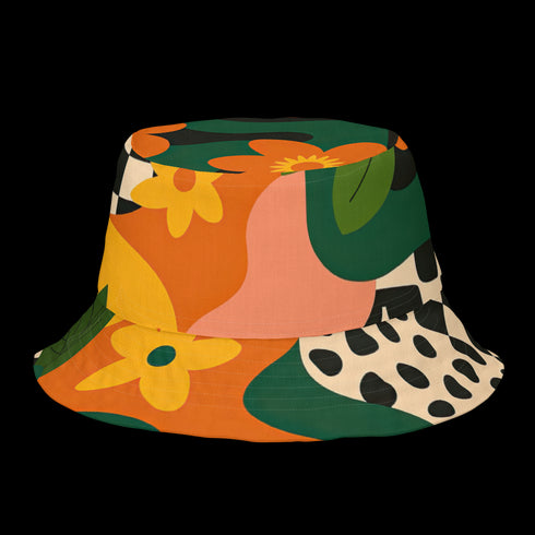 Reversible unisex bucket hat featuring two distinct retro-inspired designs - one side showcases a vibrant 70s-style floral pattern with large orange and yellow flowers, green leaves, and black polka dot accents on cream and coral backgrounds, while the reverse side displays a sophisticated brown and beige floral pattern with orange blooms and neutral tones. Made from 100% polyester with textured linen feel, this moisture-wicking and breathable hat is available in XS, S/M, and L/XL sizes, perfect for vintage