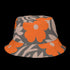 Reversible unisex bucket hat featuring two distinct retro-inspired designs - one side showcases a vibrant 70s-style floral pattern with large orange and yellow flowers, green leaves, and black polka dot accents on cream and coral backgrounds, while the reverse side displays a sophisticated brown and beige floral pattern with orange blooms and neutral tones. Made from 100% polyester with textured linen feel, this moisture-wicking and breathable hat is available in XS, S/M, and L/XL sizes, perfect for vintage