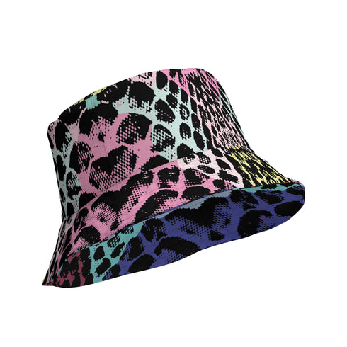 Reversible bucket hat with colorful snakeskin print in pastel shades of pink, blue, and yellow
