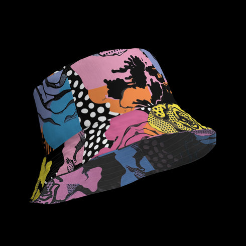 Abstract pop art floral bucket hat featuring a vibrant and bold artistic design with colorful floral motifs in bright pink, orange, yellow, blue, and black tones. The design showcases oversized abstract flowers, coral-like organic shapes, and decorative patterns with dots and stripes in a contemporary pop art style. Made from 100% polyester with textured linen feel, this moisture-wicking and breathable unisex hat is available in XS, S/M, and L/XL sizes, perfect for festivals, streetwear, and artistic fashio