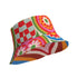 Reversible all-over print unisex bucket hat featuring two distinct bold designs. Side one showcases a psychedelic wavy stripe pattern in deep red, orange, green, blue, cream, and blush. Side two features a retro 70s groovy floral medallion print with large daisy motifs, red petals, yellow centers, and concentric pink, orange, and green rings on a cream background. Made from 100% polyester with a soft linen-feel texture. Moisture-wicking and breathable. Unisex sizing: XS/S and M/L/XL.