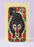 Dual layer matte phone case with a 2D print that mimics thick crewel embroidery. An angry black possum with a white face, bared sharp teeth, and bright red eyes and claws sits at the center on a cream background, framed by a symmetrical border of red folk art daisies with yellow centers and green leaves. Smooth printed surface with no raised threads, open ports, and a precise camera cutout. Goblincore, creepy cute, maximalist phone accessory.