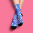 Psychedelic ankle socks featuring a bold blue and purple marble swirl pattern with black reinforced heel and toe, made from a stretchy polyester, nylon, and spandex blend, one size fits most, unisex, vibrant statement accessory for alternative and festival fashion lovers.