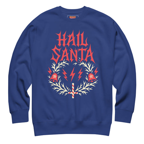 A unisex crewneck sweatshirt shown in red, green, and blue color options. The graphic features "HAIL SANTA" in a red, jagged, heavy metal-style font. The text is framed by a cream-colored wreath made of thorny branches. Inside the wreath are two red lightning bolts and two red bells with cream-colored pentagrams. An inverted candy cane cross sits at the bottom. This alternative holiday sweater has fleece texture, ribbed cuffs, and a classic fit, designed for goth, punk, and metalhead aesthetics.