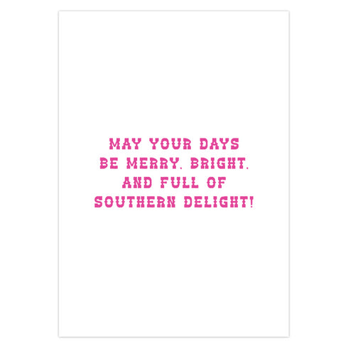 Colorful Christmas card with a yellow background. Features a stylized cowboy boot decorated with a skull, hearts, and swirls in pink, orange, and purple. The boot wears a pink Santa hat. A green cactus stands beside the boot. Top text reads 'Y'ALL BEWARE, CHRISTMAS IS HERE!' in red, wavy letters. Card has a purple border. Inside message: 'May Your days be merry, bright and full of southern delight.' The design blends Christmas, Western, and Day of the Dead motifs for a unique, playful holiday greeting