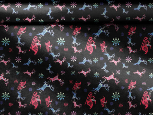 Christmas wrapping paper with a black background featuring colorful, stylized reindeer and Santa's sleigh designs. The reindeer and sleigh silhouettes are filled with skeletal patterns in shades of blue, pink, and red. Multicolored snowflakes in various sizes are scattered throughout. The paper has a whimsical, slightly gothic aesthetic that blends traditional holiday imagery with a unique, edgy twist.