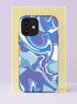 Front view of a dual layer tough phone case printed edge to edge with a liquid marble swirl in cool tones. Flowing ribbons of periwinkle, lavender, sky blue, cobalt, and bright white twist and fold across the case in a smooth psychedelic pour, like ink dropped in water. No hard lines, just calm movement in shades of blue and purple. Dreamy pastel marble phone accessory for blue mood days, with open ports and a precise camera cutout.