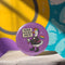 Purple pinback button featuring cartoon goose with rainbow mohawk wearing black military-style jacket with resistance patches and combat boots, holding "Honk Against Hate" protest sign and rainbow pride flag, set against purple background with stars, designed for activism and LGBTQ solidarity support