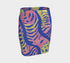 High-waisted mini skirt with a vibrant pastel tiger stripe pattern in electric blue, soft pink, yellow, and violet. The bodycon silhouette hugs curves with a comfy elastic waistband and stretch fabric. Available in smooth performance fabric or glitter finish. A maximalist fashion piece for festivals, summer outfits, and ravewear.