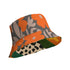 Reversible unisex bucket hat featuring two distinct retro-inspired designs - one side showcases a vibrant 70s-style floral pattern with large orange and yellow flowers, green leaves, and black polka dot accents on cream and coral backgrounds, while the reverse side displays a sophisticated brown and beige floral pattern with orange blooms and neutral tones. Made from 100% polyester with textured linen feel, this moisture-wicking and breathable hat is available in XS, S/M, and L/XL sizes, perfect for vintage