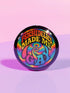 Round glossy pinback button measuring 2.25 inches featuring a vibrant rainbow psychedelic swirl with retro-style text that reads “Psychedelics Made Me Gay.” The background is a mix of rainbow waves and sparkles, with bold, colorful typography in orange, yellow, and blue. Made from durable tinplate with a safety pin backing, scratch-resistant mylar coating, and a high-gloss finish. Ideal for jackets, backpacks, or pride festival accessories.