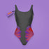 a woman's swimsuit on a purple background