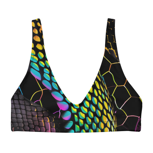 Sports-bra-style bikini top with wide straps and scoop neckline, featuring a vibrant holographic snake print in neon yellow, pink, purple, and blue tones over black. Hexagon pattern overlays add a cyber-sleek finish. Floating above a turquoise pool, this statement swim top brings futuristic Y2K energy to any swimwear collection. Ideal for alt baddies, rave queens, and dopamine dressers.