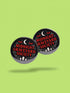 A collection of four glossy black circular pinback buttons featuring striking red and white gothic illustrations. One button shows "Midnight Graveyard Society" text with bats and tombstones. Another reads "Cemetery Picnic Society" with a coffin and umbrella icon. A third features a detailed white skull and red roses with "Memento Mori" text below. The final pin displays "Nocturnal Flower Society" surrounded by floral vines.