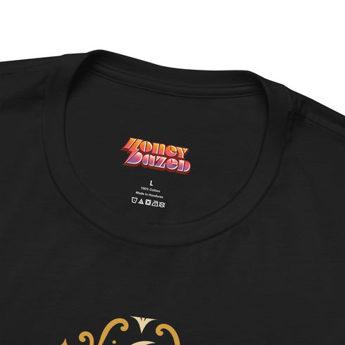 A black unisex crewneck graphic t-shirt featuring an ornate Victorian-inspired emblem printed on the chest in vintage gold and off-white. The centralized, symmetrical design showcases a classic coffin with a cross on the lid, flanked by wrought-iron cemetery gates. Beautiful scrollwork and decorative filigree flourishes surround the bold, retro serif text reading CEMETERY PICNIC SOCIETY. A crescent moon and stars sit at the top, completing this gothic memento mori graphic shirt.