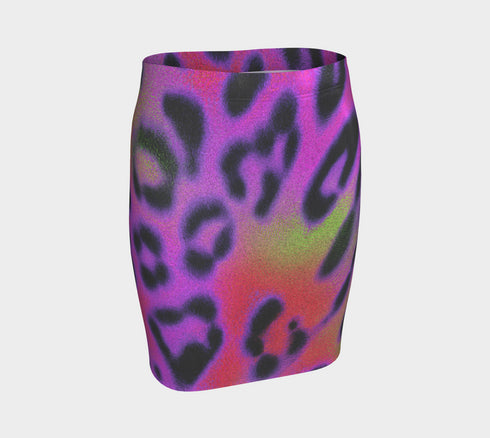 A high-waisted, bodycon mini skirt with a vibrant psychedelic floral pattern. The curve-hugging skirt features a mid-thigh length and black stitching at the waistband and hem. The all-over print consists of abstract, fuzzy-edged floral bursts in electric colors, including hot pink, magenta, neon green, and electric purple, set against a black background. The skirt is shown in two finishes: a smooth, matte signature knit and a metallic glitter knit with a reflective silver foil.