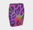 A high-waisted, bodycon mini skirt with a vibrant psychedelic floral pattern. The curve-hugging skirt features a mid-thigh length and black stitching at the waistband and hem. The all-over print consists of abstract, fuzzy-edged floral bursts in electric colors, including hot pink, magenta, neon green, and electric purple, set against a black background. The skirt is shown in two finishes: a smooth, matte signature knit and a metallic glitter knit with a reflective silver foil.