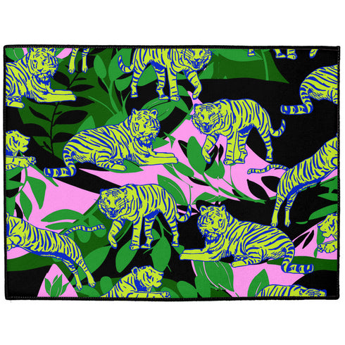 Vibrant doormat featuring stylized yellow tigers with blue stripes amidst green foliage and pink accents on a black background. Bold, maximalist design for indoor/outdoor use.