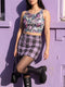 A sleeveless cropped tank top made from stretchy performance knit fabric. The all-over print features a dense, scattered pattern of pastel goth and creepy cute motifs over a light background. Graphics include pink and blue bats in flight, floating eyeballs with blue irises, pink skulls, and glossy vampire lips with sharp white fangs and tongues sticking out. The neckline is a high scoop and the armholes are curved. The fabric comes in either a matte finish or a sparkly silver glitter foil.