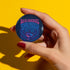 Round pinback button with glossy finish featuring the phrase “Bi-Fi Signal Tune Into the Spectrum” in pink and blue psychedelic lettering, with a satellite dish graphic, available in 2-inch and 3-inch sizes.