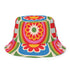 Reversible all-over print unisex bucket hat featuring two distinct bold designs. Side one showcases a psychedelic wavy stripe pattern in deep red, orange, green, blue, cream, and blush. Side two features a retro 70s groovy floral medallion print with large daisy motifs, red petals, yellow centers, and concentric pink, orange, and green rings on a cream background. Made from 100% polyester with a soft linen-feel texture. Moisture-wicking and breathable. Unisex sizing: XS/S and M/L/XL.