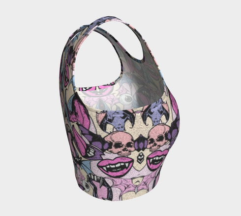 A sleeveless cropped tank top made from stretchy performance knit fabric. The all-over print features a dense, scattered pattern of pastel goth and creepy cute motifs over a light background. Graphics include pink and blue bats in flight, floating eyeballs with blue irises, pink skulls, and glossy vampire lips with sharp white fangs and tongues sticking out. The neckline is a high scoop and the armholes are curved. The fabric comes in either a matte finish or a sparkly silver glitter foil.