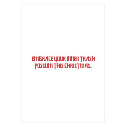 A playful holiday card featuring a raccoon wearing a Santa hat, popping out of a trash can with a mischievous grin. The text above reads "Have Yourself a Trashy Little Christmas" in bold, dripping letters. The card combines humor with a grungy, festive theme for a lighthearted take on the holiday season.
