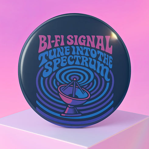 a black button with the words, bi - signal tune into the spectroh