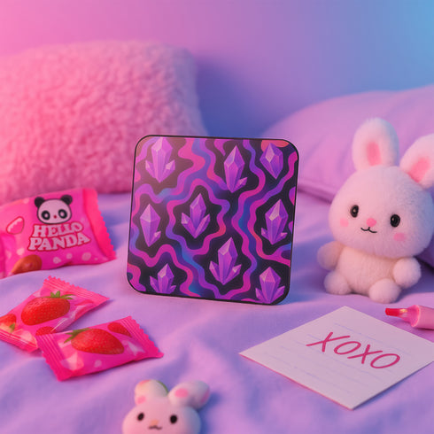 Square drink coaster with a psychedelic design featuring bright purple crystal shards over pink and black wavy patterns. The coaster is made from hardboard MDF with a cork backing and a high-gloss finish. It measures 3.74 by 3.74 inches and is water-repellent, heat-resistant, and easy to clean. Ideal for pastel goth, witchy, coquette, or maximalist room decor and gifting occasions.